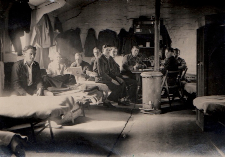 WWII prisoners-England-Robert to right of man with newspaper